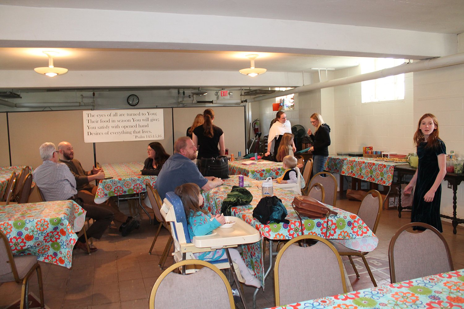 Children and families at a fellowship meal